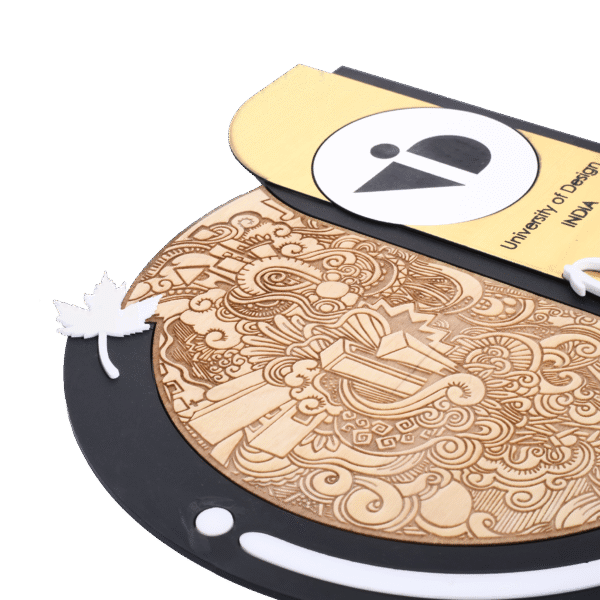 Modern artistic trophy with wood-engraved doodle, gold detailing, and “Best Design Project Award” tag, created for University of Design India.