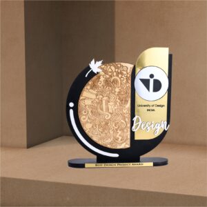 Modern artistic trophy with wood-engraved doodle, gold detailing, and “Best Design Project Award” tag, created for University of Design India.