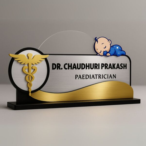 Pediatrician desk name plate with sleeping baby and caduceus design in gold and silver acrylic