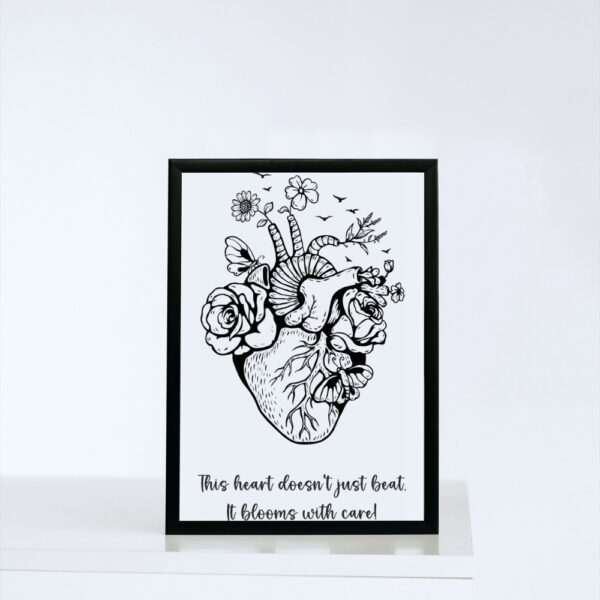A black-and-white anatomical heart illustration filled with blooming flowers, butterflies, and birds, paired with the quote: “This heart doesn’t just beat. It blooms with care!”