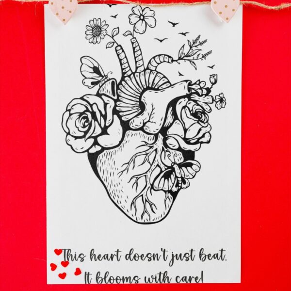 A black-and-white anatomical heart illustration filled with blooming flowers, butterflies, and birds, paired with the quote: “This heart doesn’t just beat. It blooms with care!”