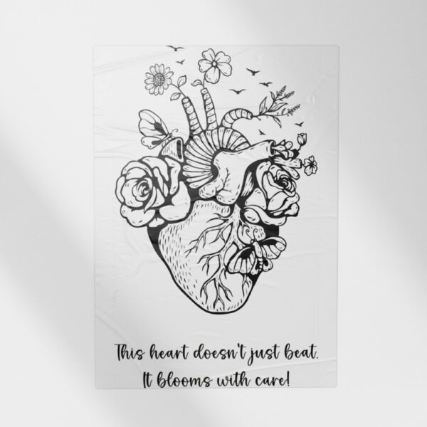 A black-and-white anatomical heart illustration filled with blooming flowers, butterflies, and birds, paired with the quote: “This heart doesn’t just beat. It blooms with care!”
