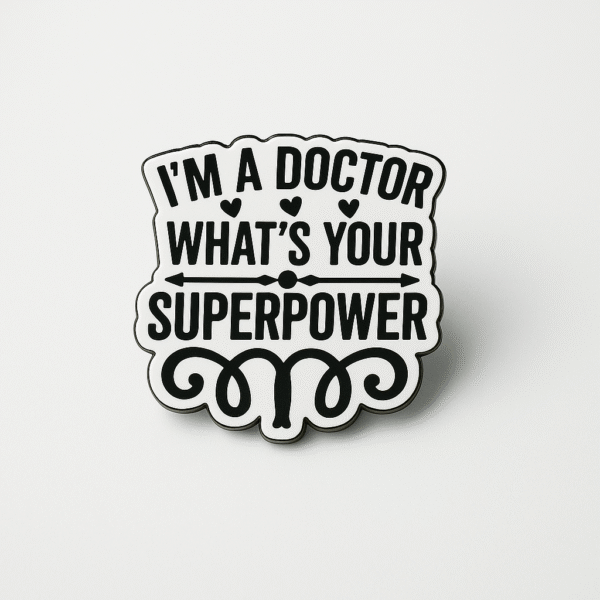 White and black enamel brooch with the quote “I’m a Doctor, What’s Your Superpower?” designed exclusively for doctors.
