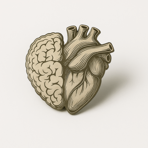 Antique-style brooch showing a fusion of brain and heart, symbolizing intelligence and compassion in medicine.