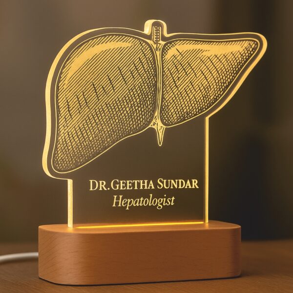 Custom LED night lamp with a detailed anatomical liver engraving, personalized with the name “Dr. Geetha Sundar – Hepatologist,” displayed on a wooden base in a hospital corridor.