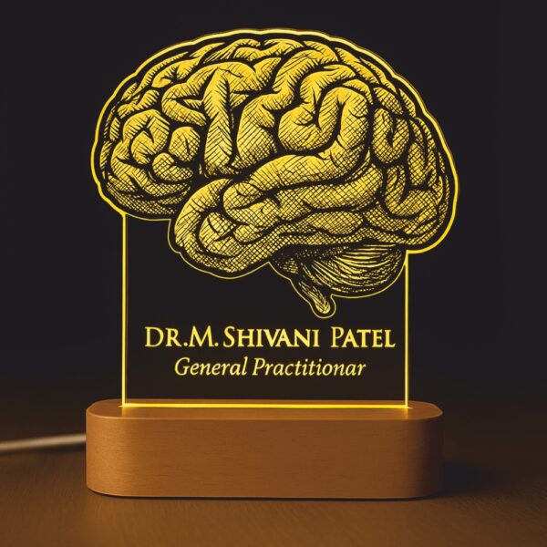 Personalized LED night lamp featuring a detailed brain illustration with the name “Dr. M. Shivani Patel – General Practitioner,” glowing warmly on a wooden base placed on a doctor’s desk.