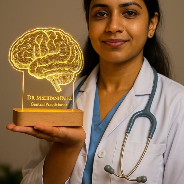 Personalized LED night lamp featuring a detailed brain illustration with the name “Dr. M. Shivani Patel – General Practitioner,” glowing warmly on a wooden base placed on a doctor’s desk.
