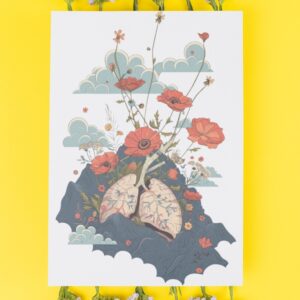 A surreal art print featuring anatomical lungs blossoming into vivid red flowers and stems, set against a dreamy sky with clouds and mountains.