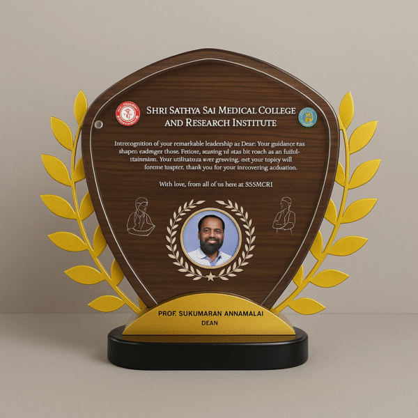 Wood-finish shield-shaped memento with golden laurel branches, custom text, and dean’s photo, awarded by a medical college.