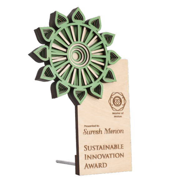 Wooden doctor award with green mandala-style design and engraved text, presented for sustainable medical innovation.