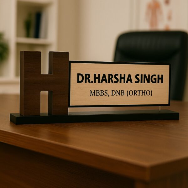 Orthopedic doctor name plate with bold H monogram, wooden base, and engraved acrylic panel for clinic desk