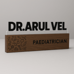 Customized pediatrician desk name plate with baby icons, wooden finish, and acrylic lettering for clinic table