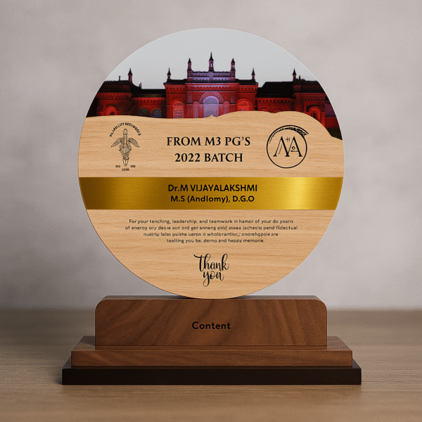 Round wooden doctor memento with medical college building photo, engraved thank-you message, and golden name band on a bookshelf.