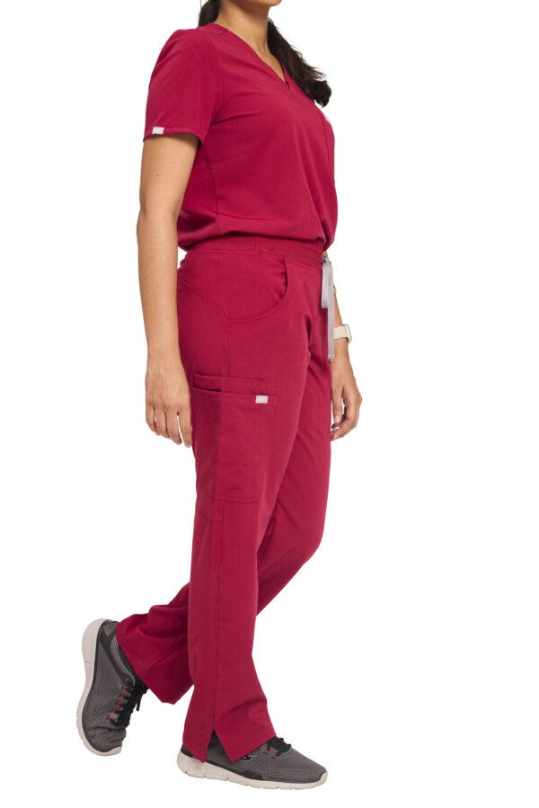 Female doctor in burgundy scrub set with stethoscope and tablet – stylish, breathable medical wear