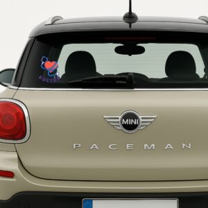 Car sticker featuring a red heart wrapped with a blue stethoscope and the word “DOCTOR” in bold red and blue lettering, designed for medical professionals