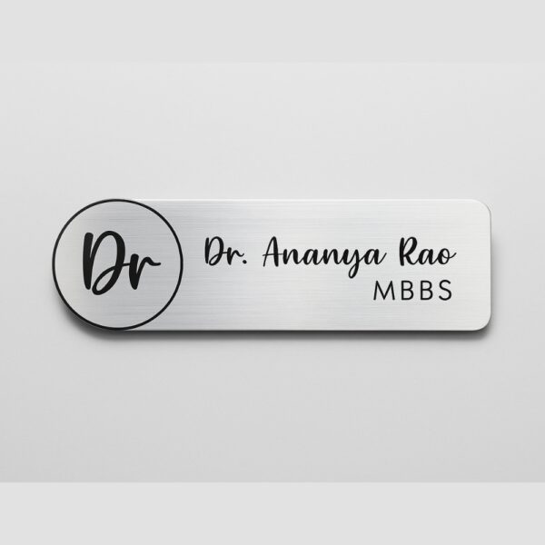 Engraved acrylic name tag with doctor’s name and degree in a brushed finish