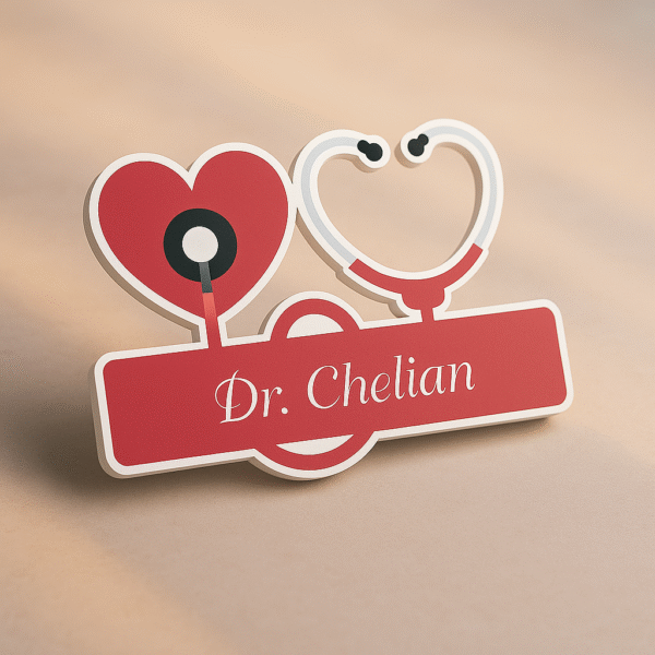 Red and white acrylic name badge featuring a heart and stethoscope design with “Dr. Chelian” printed in cursive font